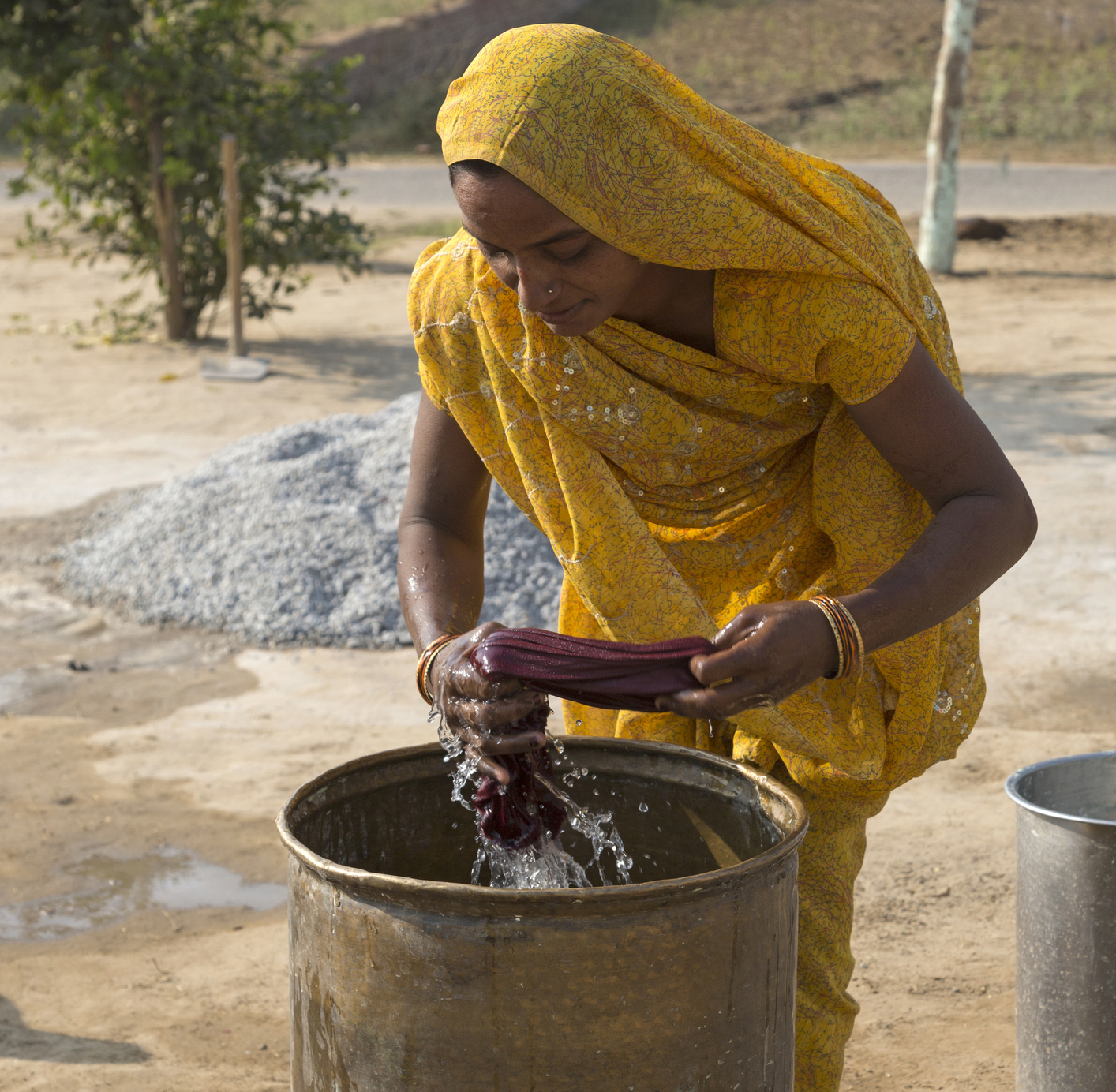 Woman washing clothes by hand, Agra, Uttar Pradesh, India