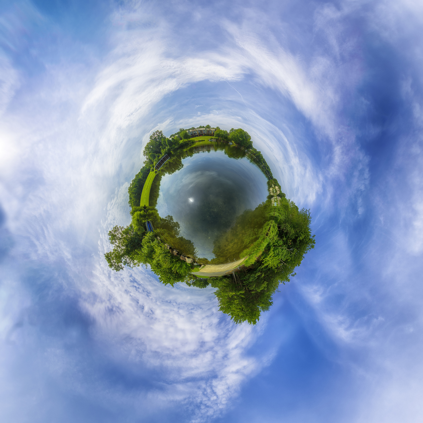 Small lush planet. Ecosystem complete with fresh water, lush trees and clean skies. Small houses border lake
