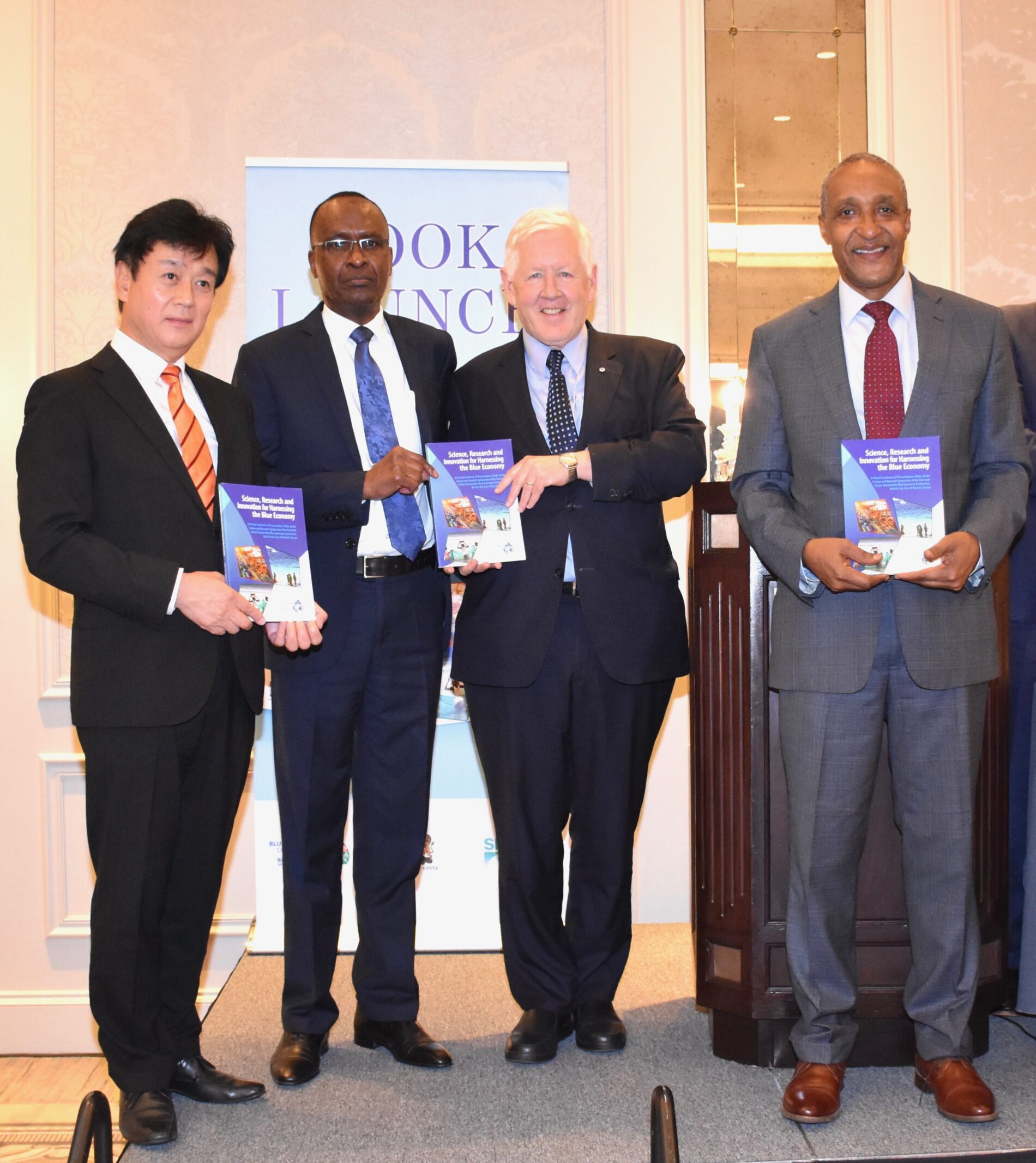 From left: Takeshi Osuga, Deputy Permanent Representative of Japan to the United Nations, Dr George Odera Outa, chief editor, Ambassador Robert Keith Rae, Permanent Representative of Canada to the United Nations, and Ambassador Kamau Macharia, Principal Secretary in the Ministry of Foreign Affairs, Kenya during the Research and Innovation for Harnessing the Blue Economy book launch at the Intercontinental Hotel in New York