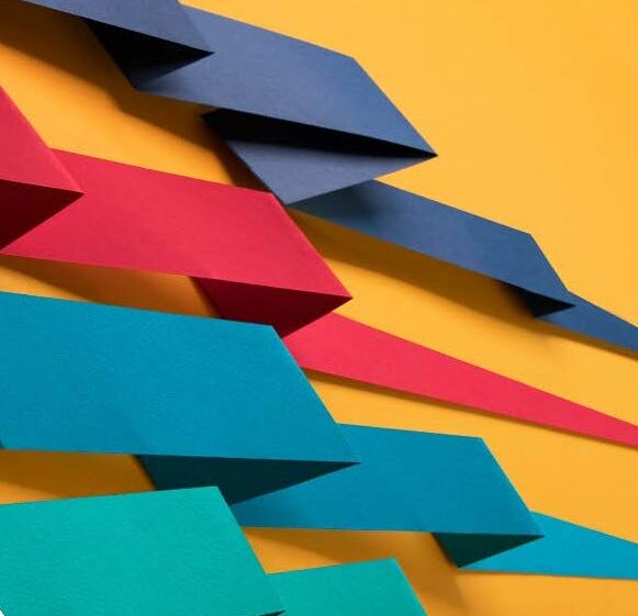 Abstract ribbons in purple, pink, blue and green on orange background