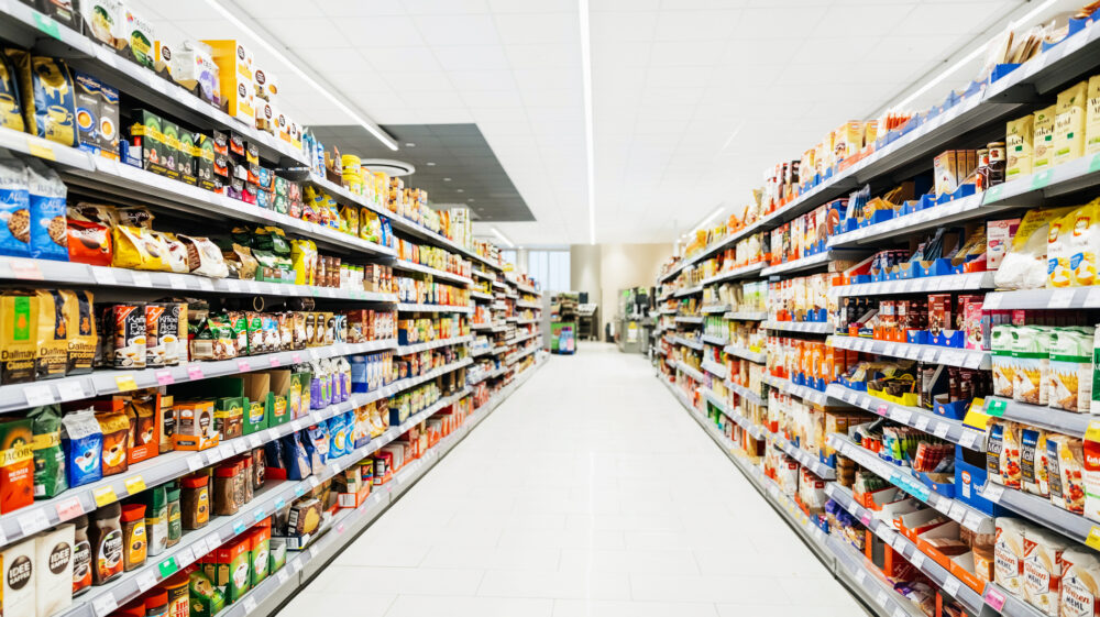 Colourful supermarket aisle with white floor and ceiling