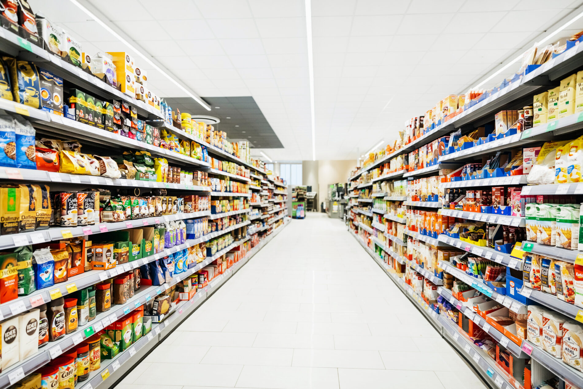 Colourful supermarket aisle with white floor and ceiling