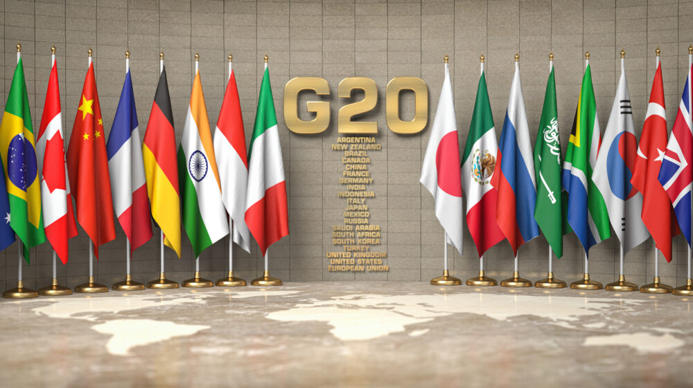 Row of flags of members of G20 and list of countries in conference room, Ukraine