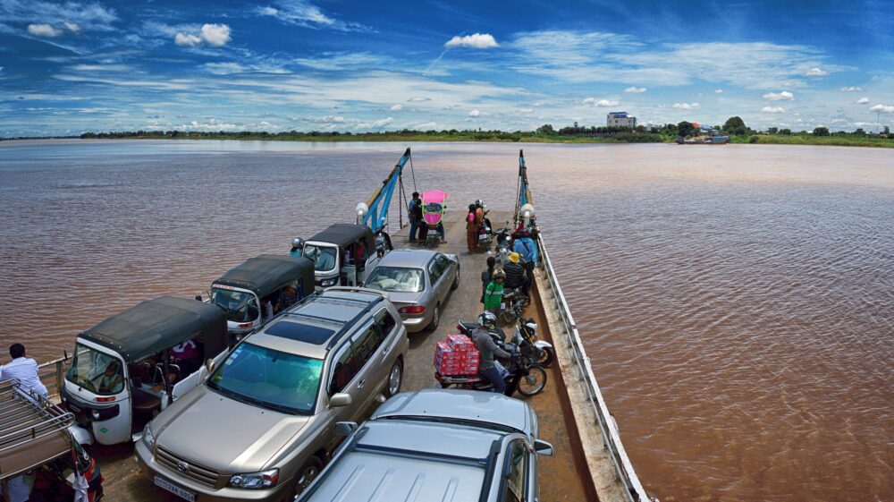Ferry pier full of cars, tuk-tuks and motorbikes, Phnom Penh, Cambodia