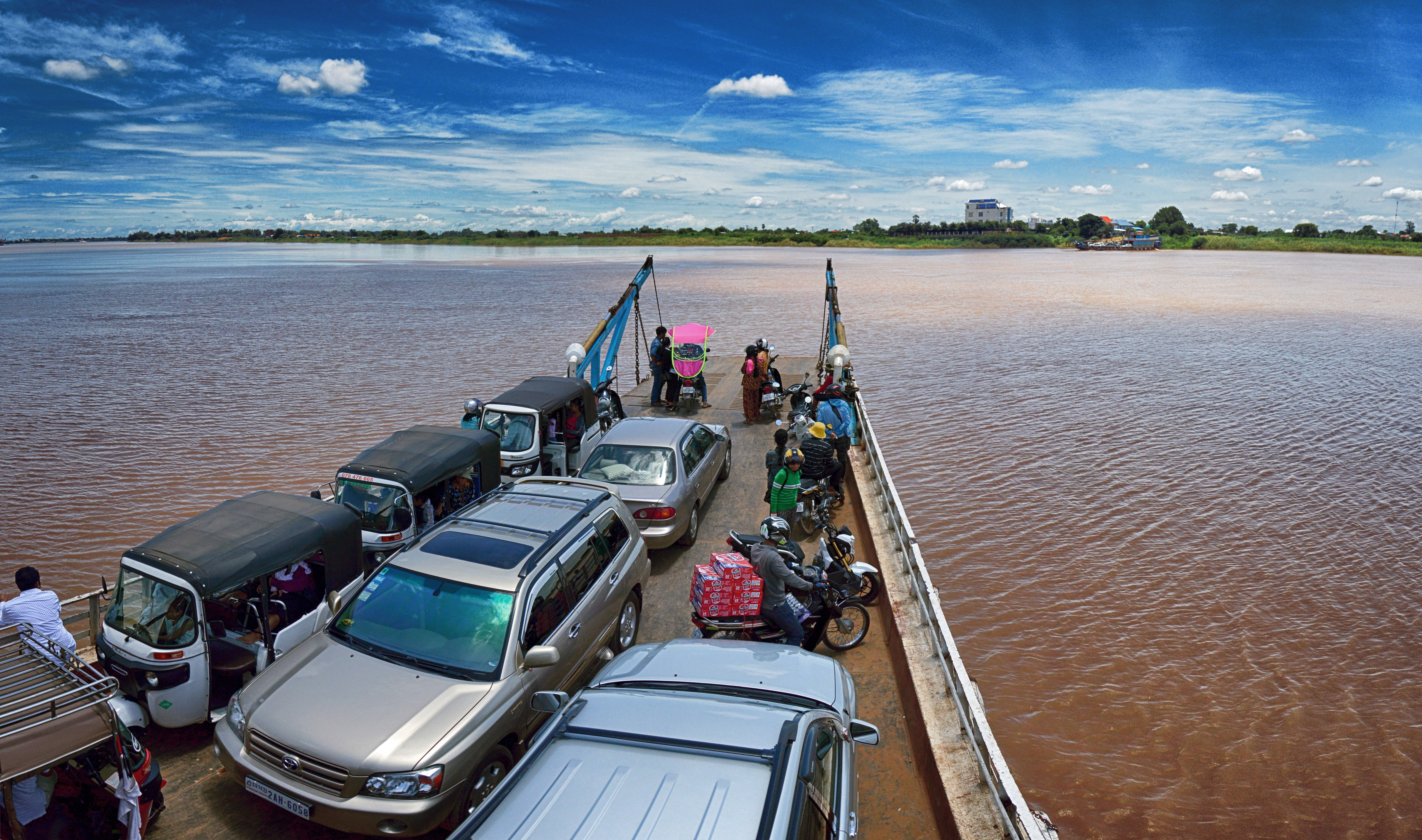 Ferry pier full of cars, tuk-tuks and motorbikes, Phnom Penh, Cambodia
