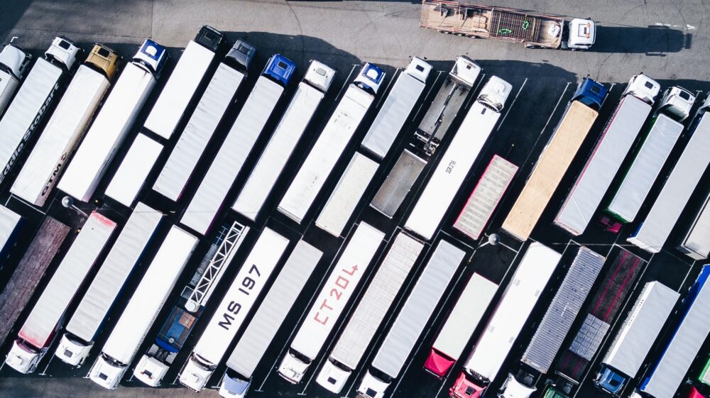Aerial view of freight trucks in parking lot, 2017