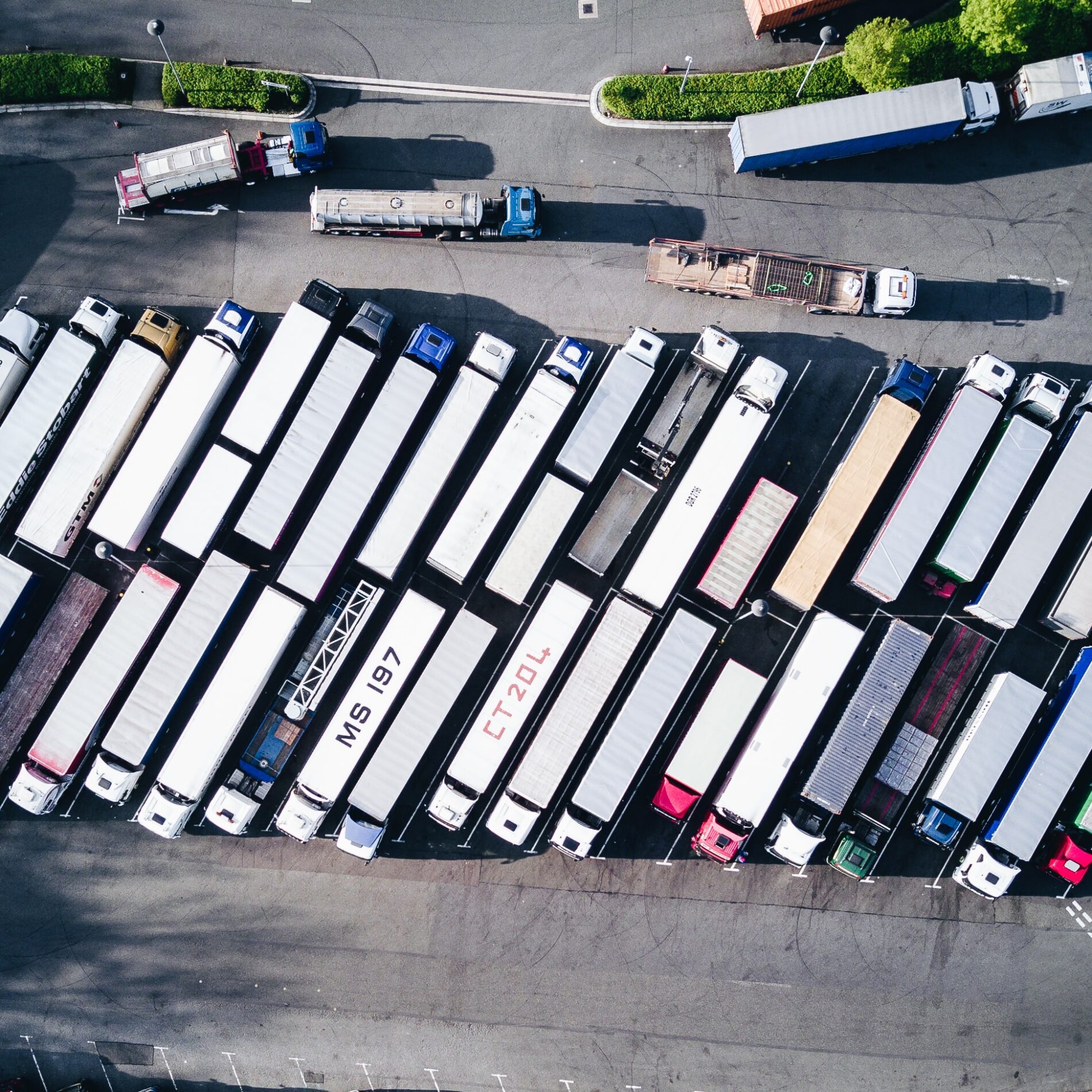 Aerial view of freight trucks in parking lot, 2017