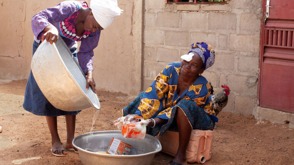 Women doing housework following successful cataract surgery, Burkina Faso
