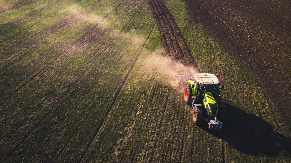 Tractor plowing field, Germany