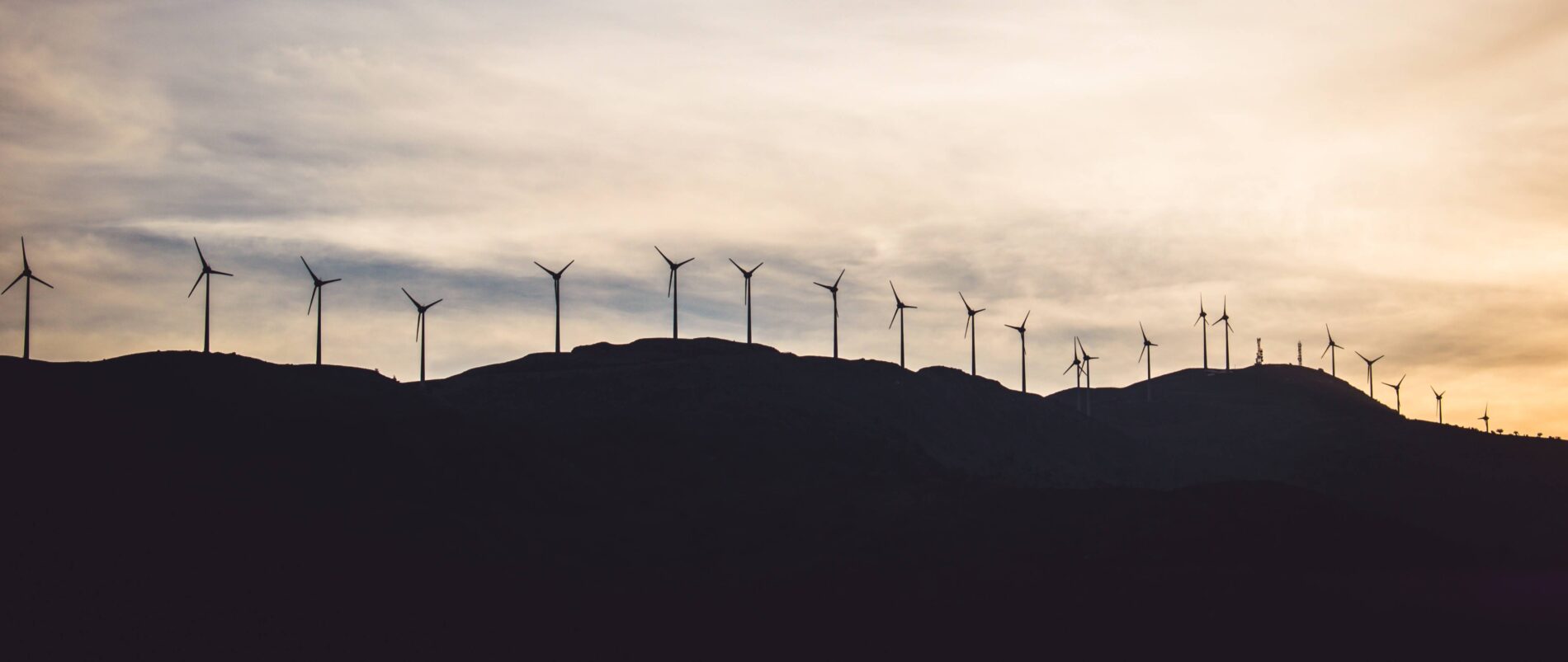 Wind turbines on hills at dusk, Kalavrita, Greece