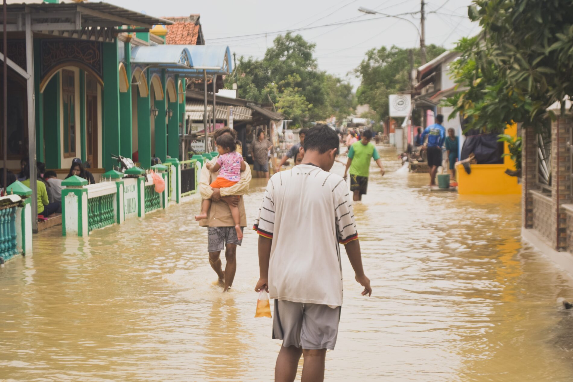 People walking on flooded street, Indonesia, April 2021