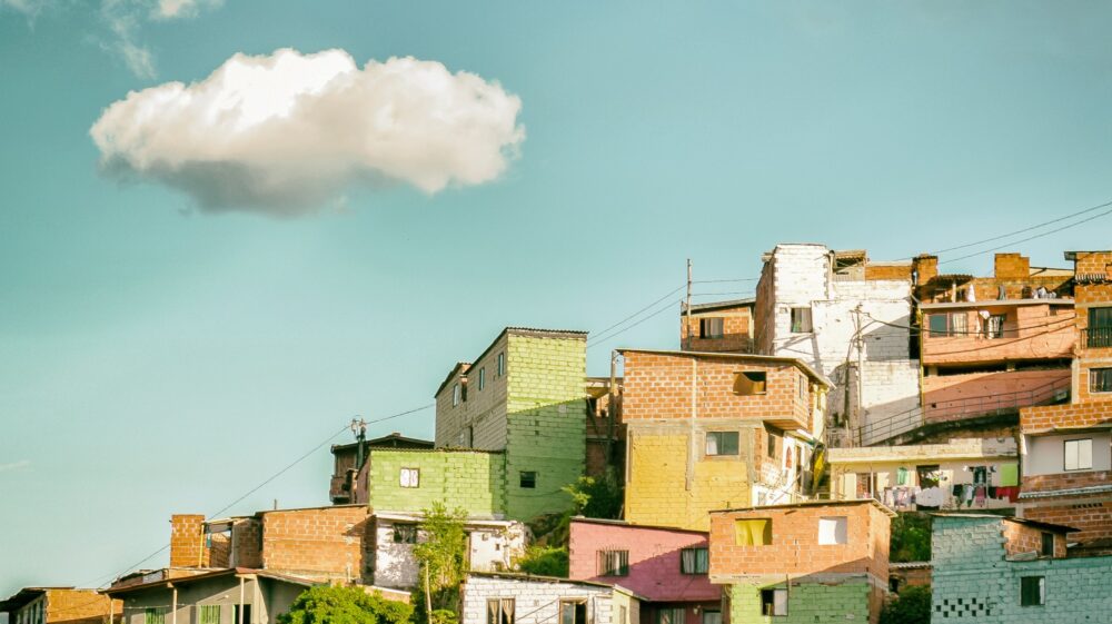 Colourful hillside homes under blue sky, Comuna 13, Medellín, Colombia
