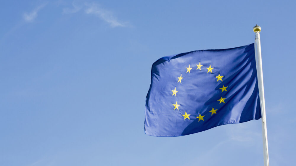 EU flag against blue sky, Sweden