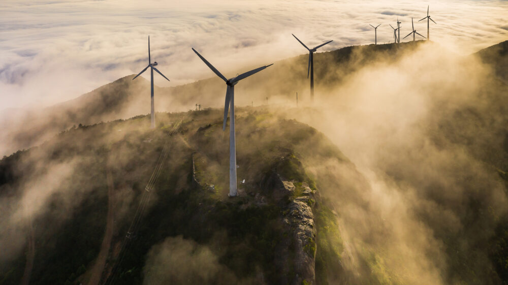 Wind farm on mountains surrounded by clouds, Taizhou, Zhejiang, China