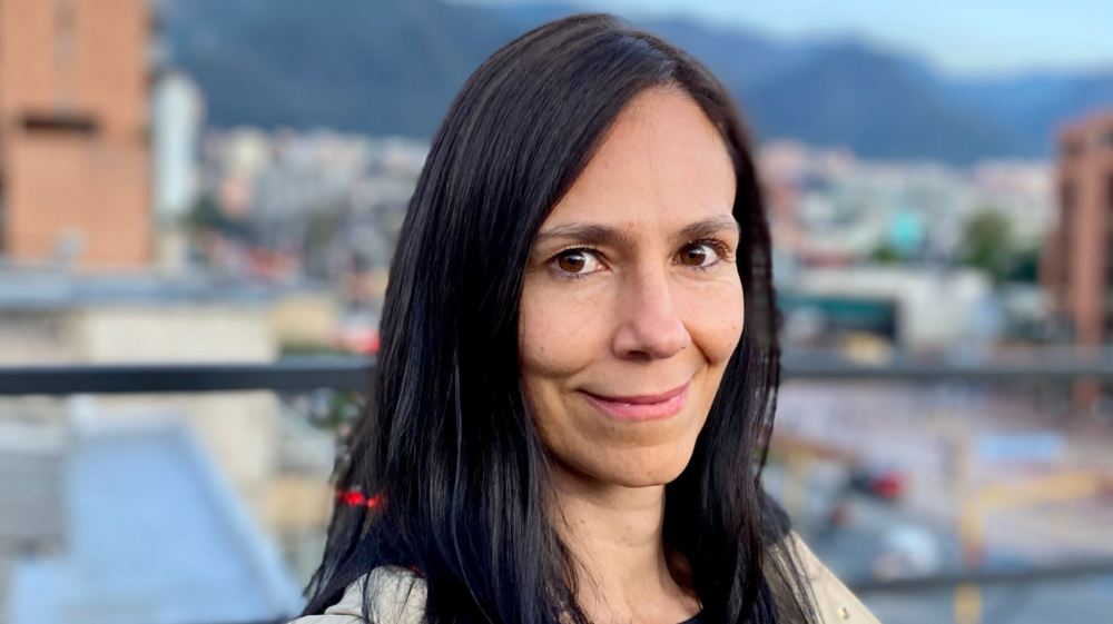Mónica Trujillo standing on rooftop