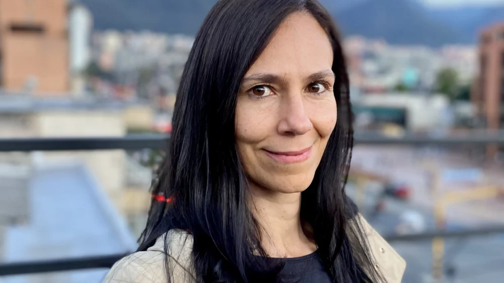 Mónica Trujillo standing on rooftop