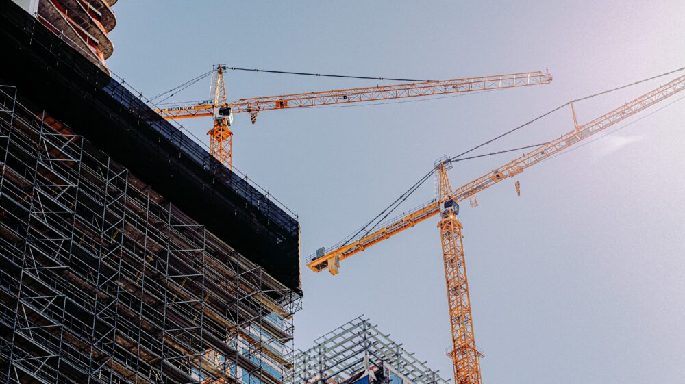 Buildings under construction and two yellow cranes, Los Angeles, California, US