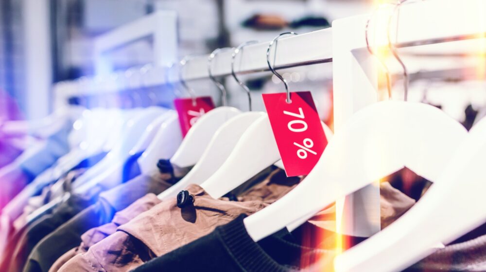 Clothes in a shop with 70% discount tag