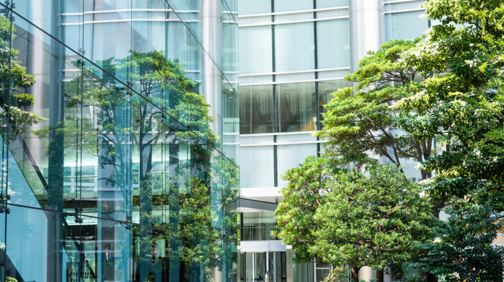Sky and clouds reflected in a modern building glass facade, Japan. Symbolizing cambridge judge MBA students