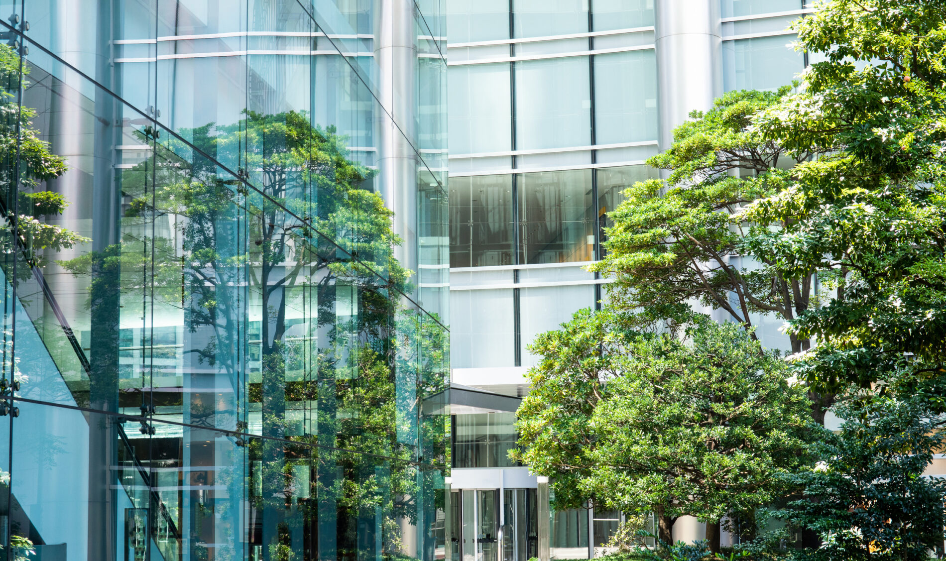 Sky and clouds reflected in a modern building glass facade, Japan. Symbolizing cambridge judge MBA students