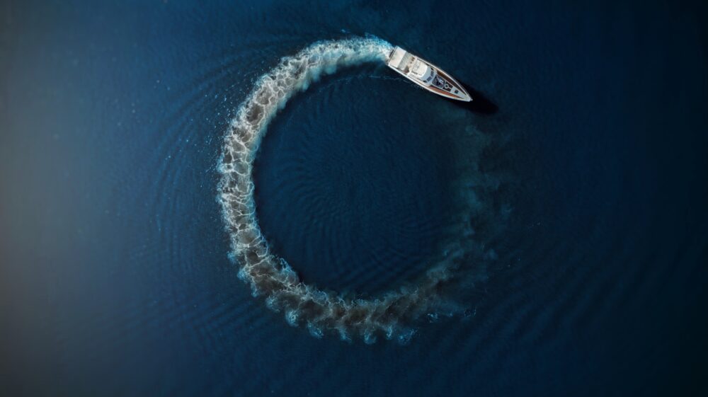 Motorboat driving in circle in water