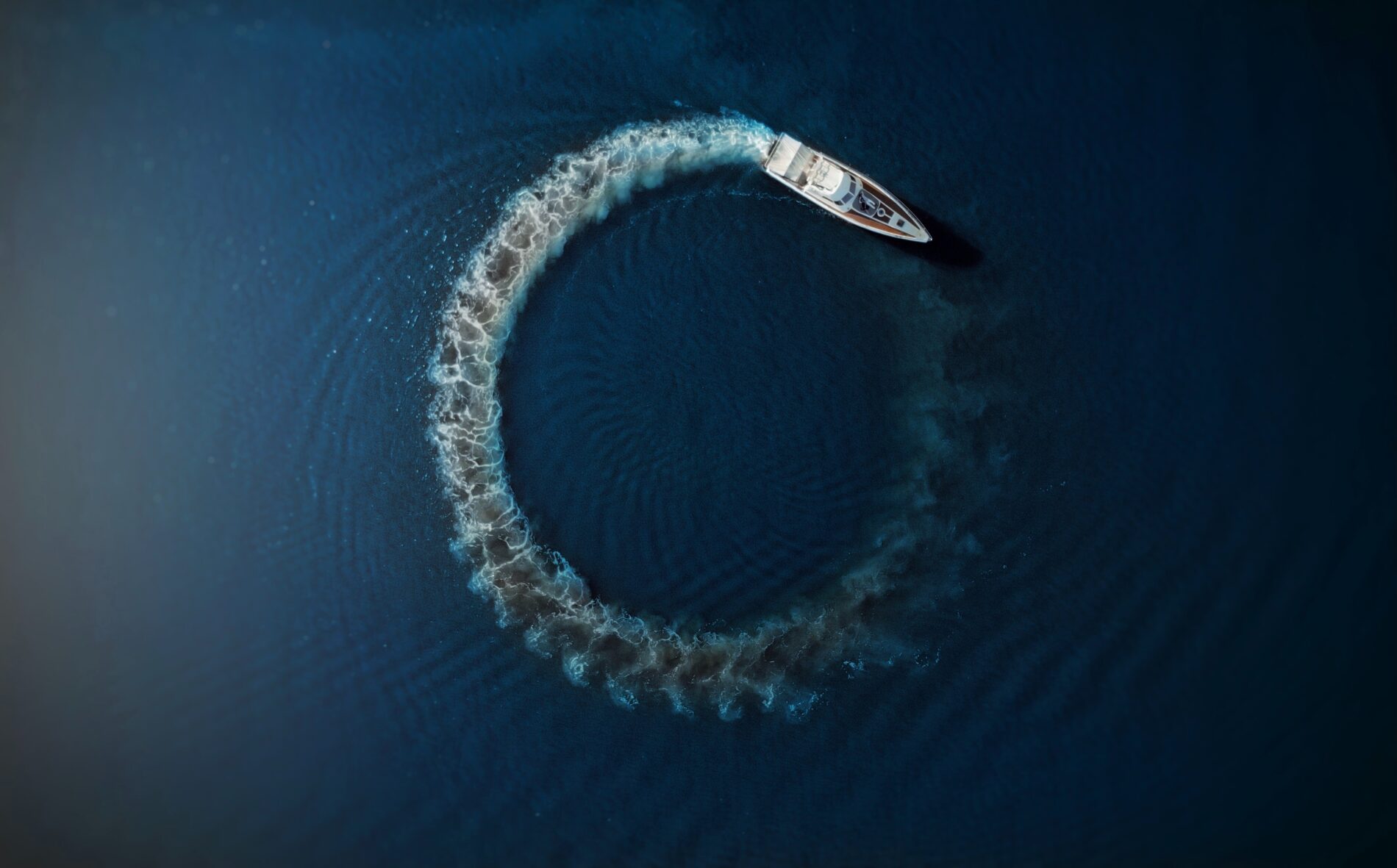 Motorboat driving in circle in water