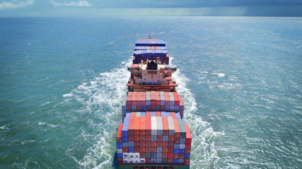 Aerial view of freight ship with cargo containers