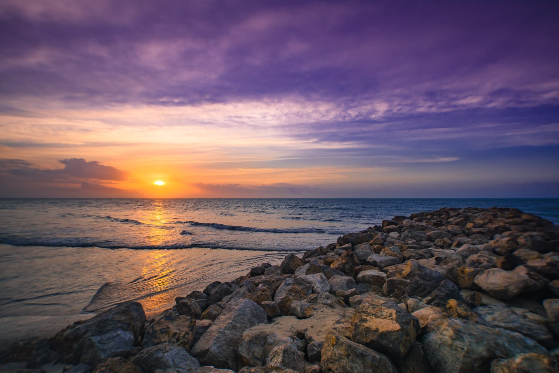 Sun sets over a rocky coast in the La Guajira region of Colombia