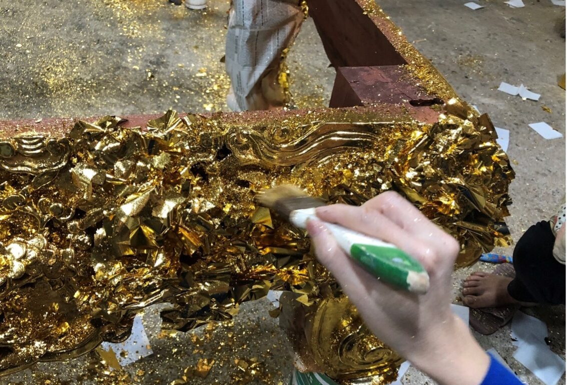 Women do the task of gold plating. The fine gold dust gets blown everywhere around the room and the ground