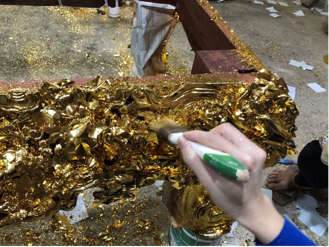 Women do the task of gold plating. The fine gold dust gets blown everywhere around the room and the ground