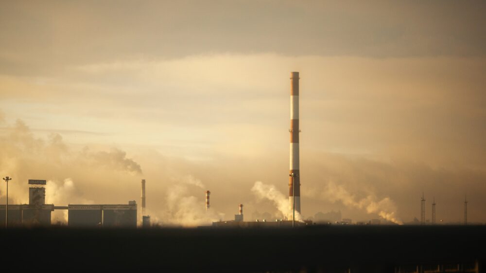 Industrial chimneys emitting smoke