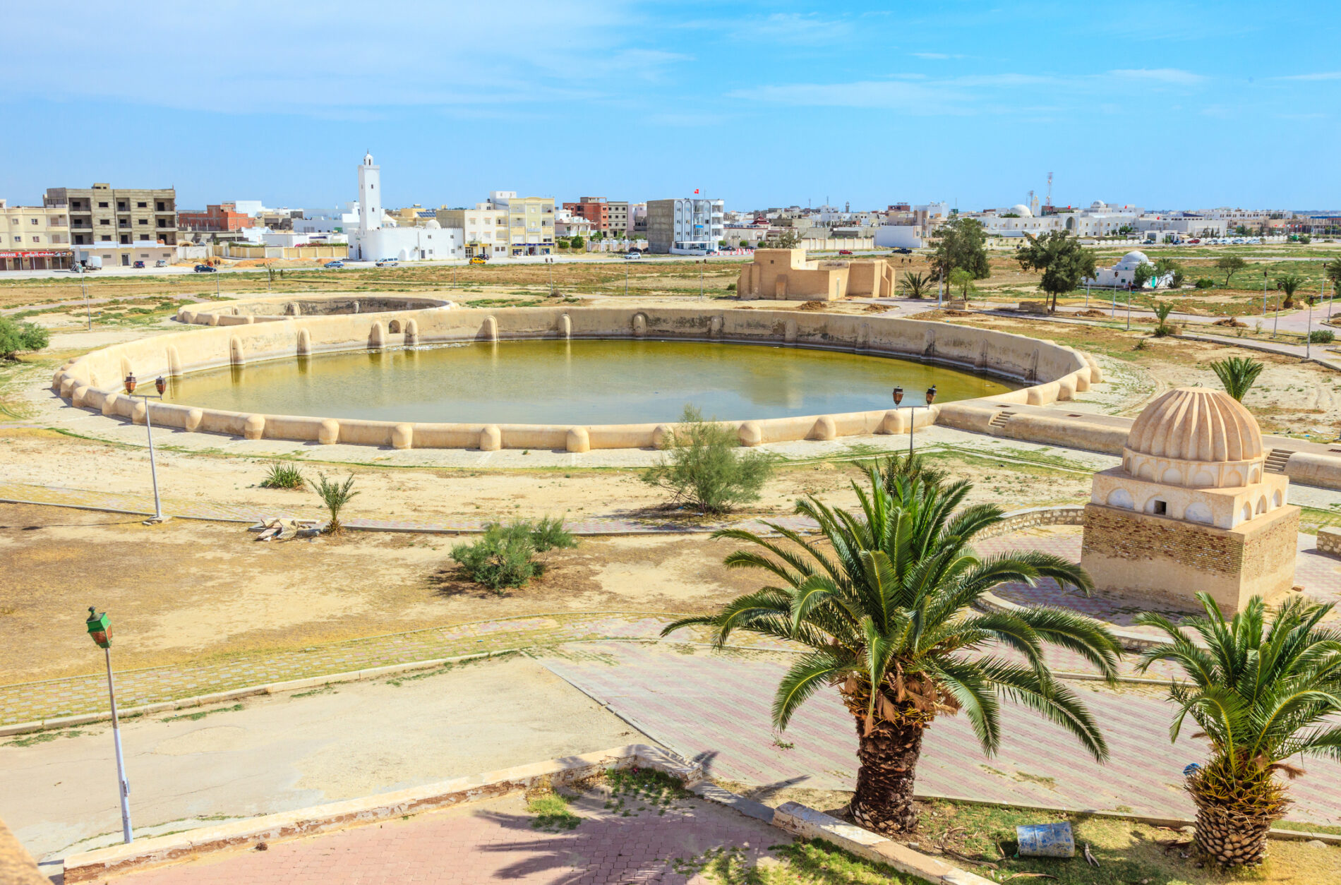 A reservoir fueled by an ancient hydraulic system is surrounded by the town of Kairouan, Tunisia, a semi-arid community that has used the hydraulic system since the 9th century.