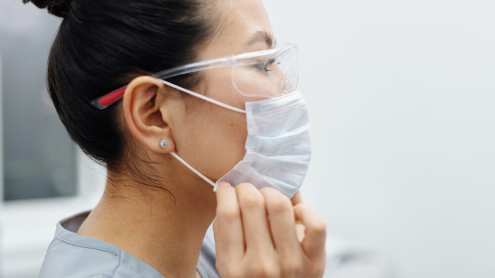 Photo Of Woman Wearing Protective Mask