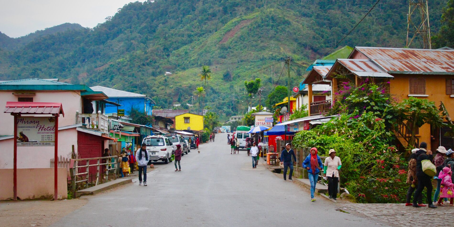 People walking on street during daytime leading to tall mountain, Madagascar
