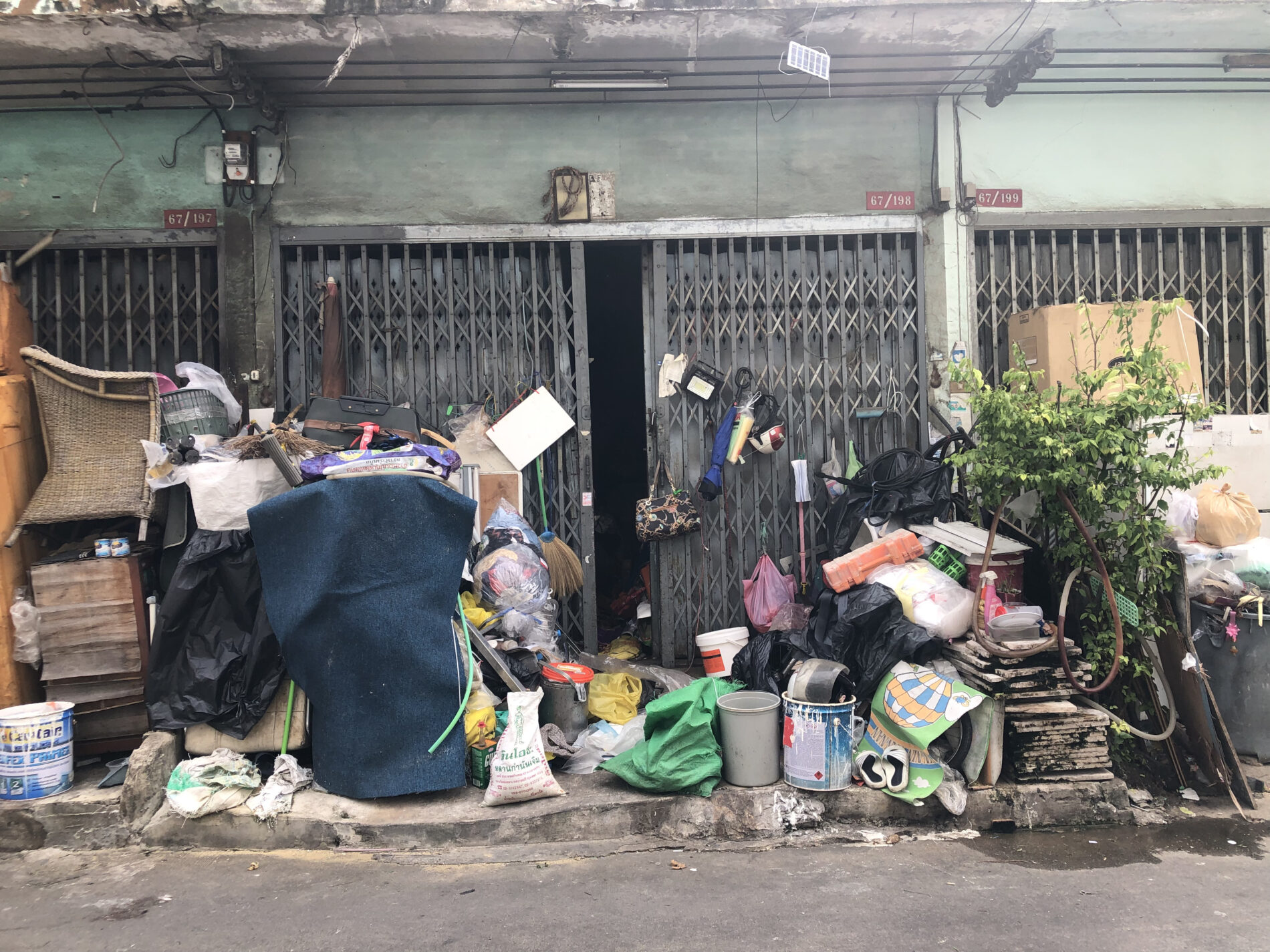 Family-owned waste shop in Yannawa, Bangkok overflowing with waste materials