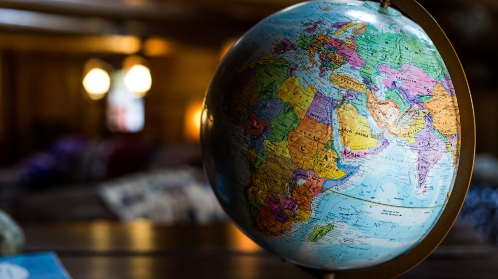 A globe sits atop a table, with Africa, Europe, the Middle East and the western part of Asia facing the viewer