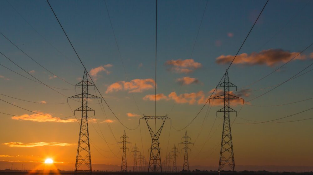 Power pylons at sunset
