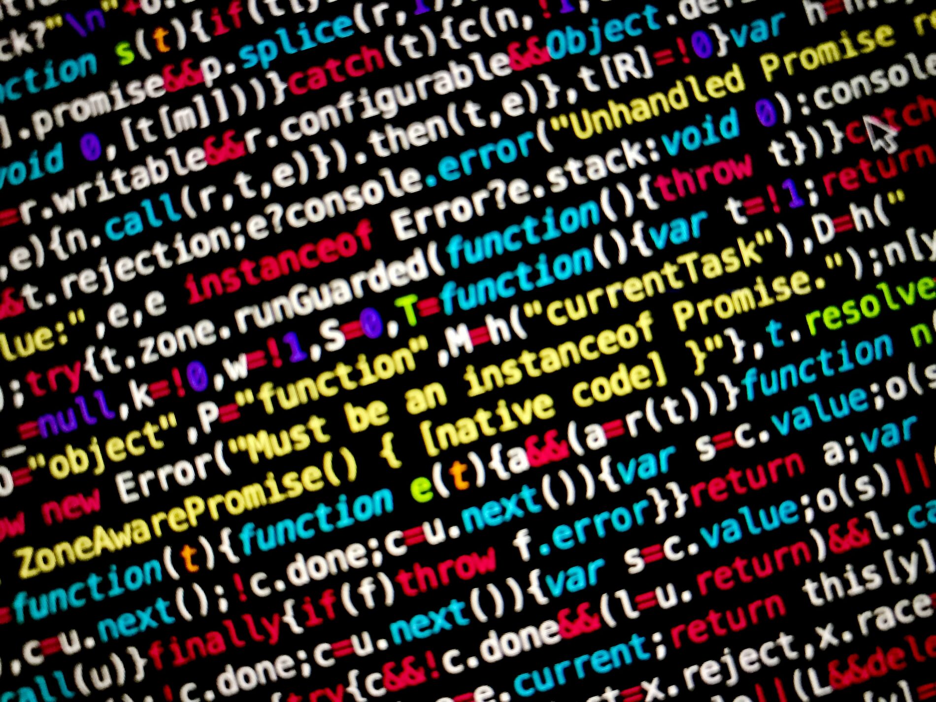 Colourful source code in code editor with black background