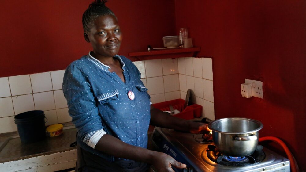 Magdalena, a cook using biogas on a farm near Arusha, Tanzania.