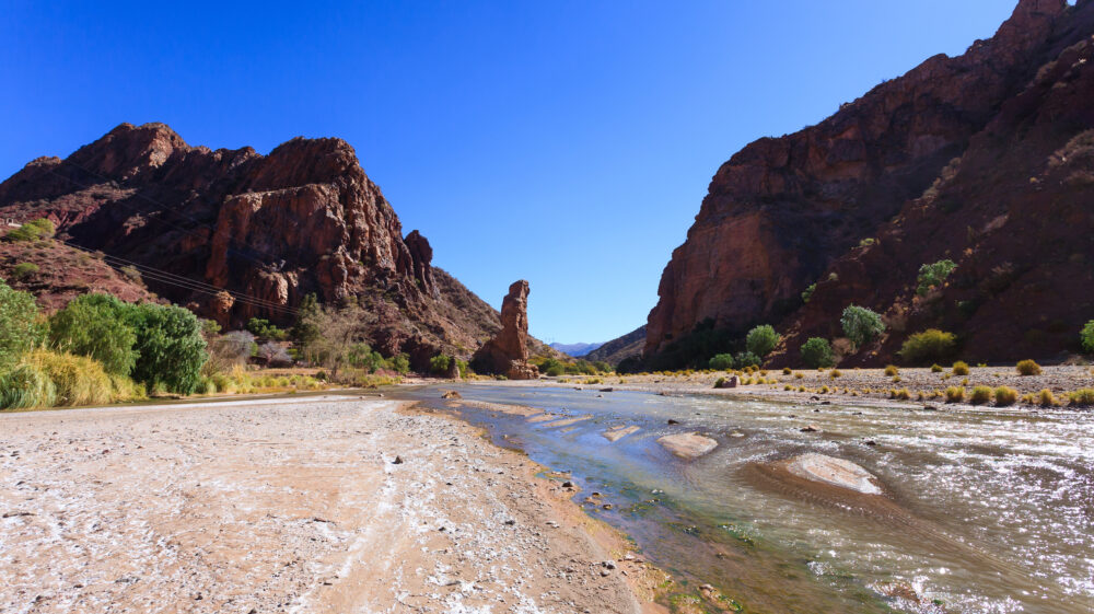 Canyon and river beneath a blue sky outside Tupiza, Bolivia