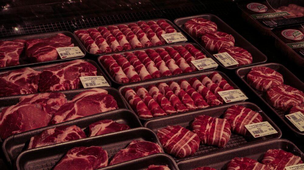 Raw meat in clear plastic pack.
