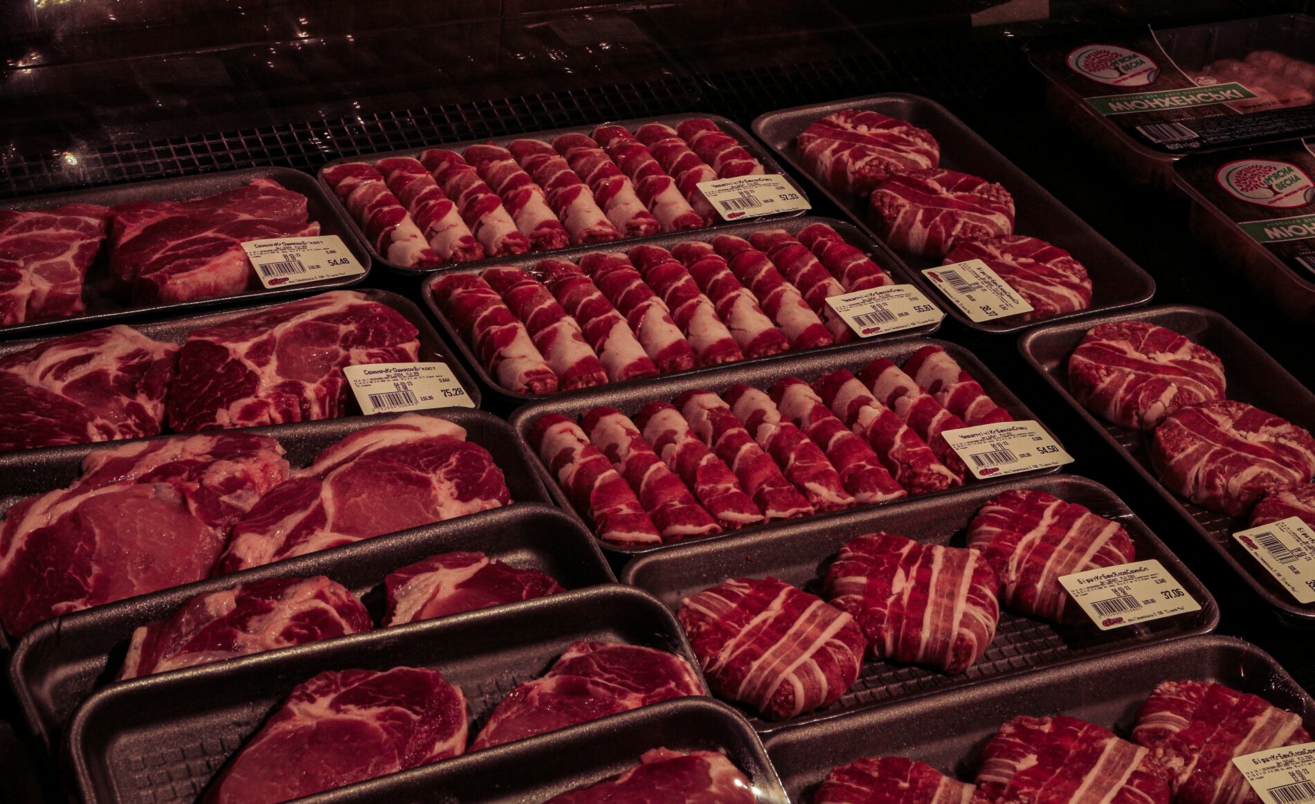 Raw meat in clear plastic pack.