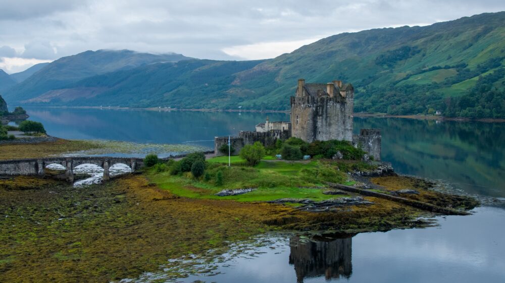 An Aerial Shot of a Castle beside a Lake, Kyle of Lochalsh, Scotland, United Kingdom