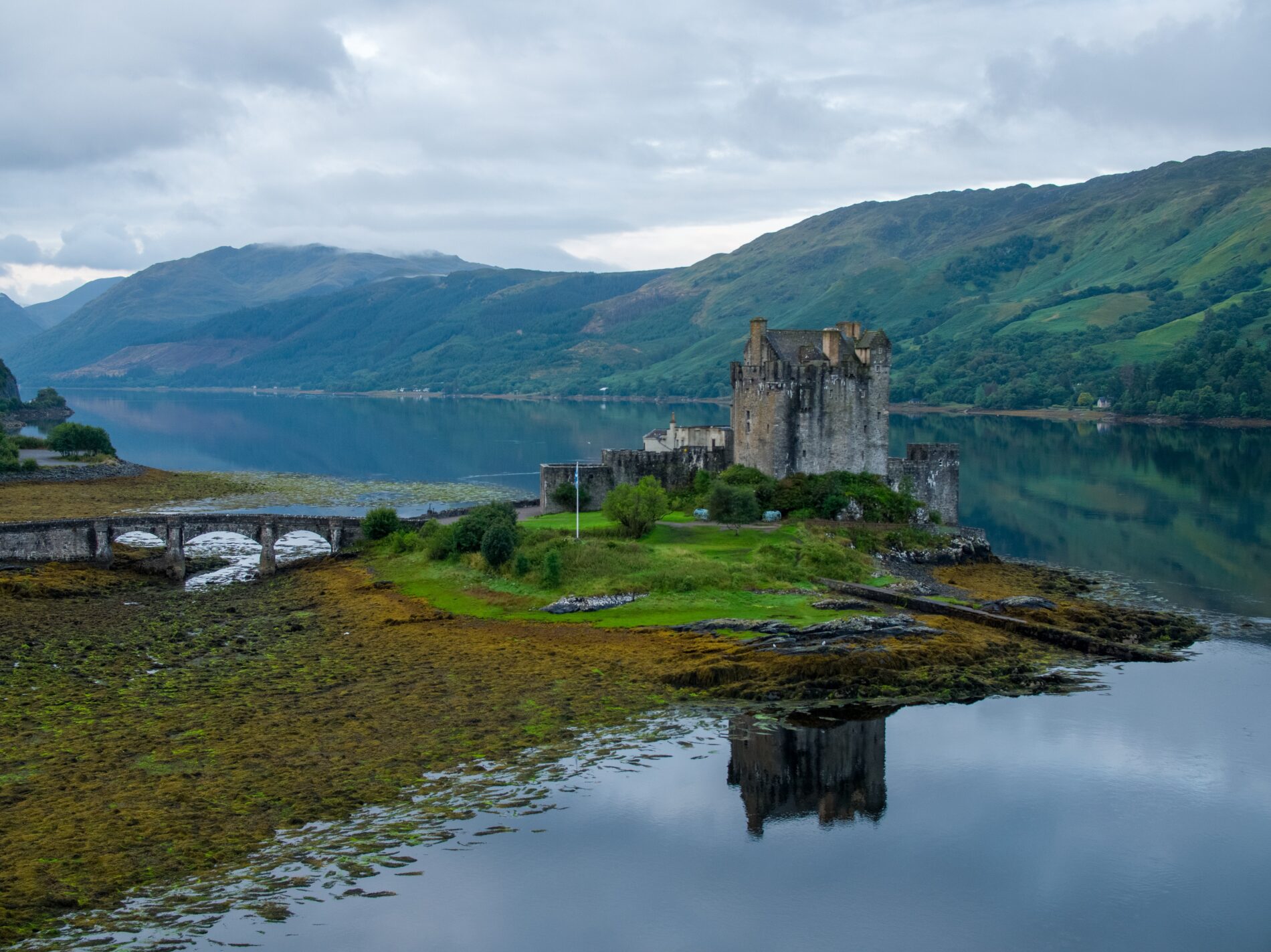 An Aerial Shot of a Castle beside a Lake, Kyle of Lochalsh, Scotland, United Kingdom