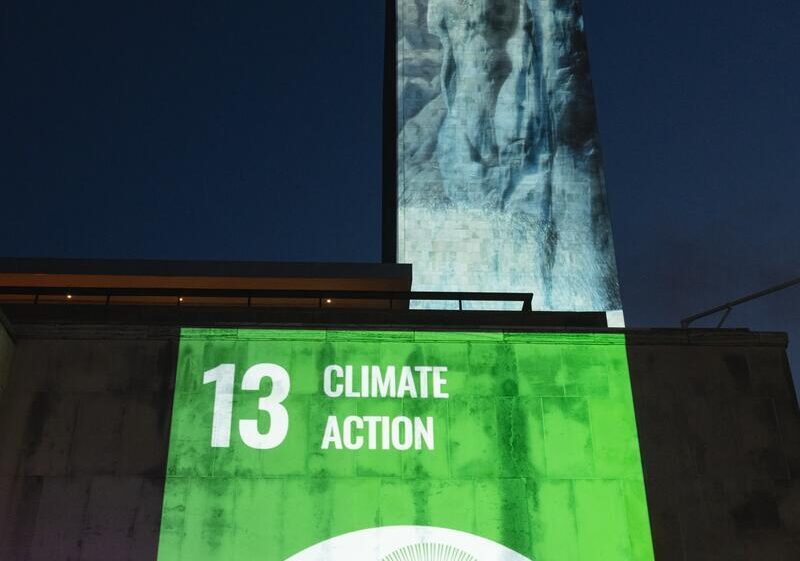 Landmark launch of Scoring for the Goals event with projection of images of green SDG 13 symbol on UN Building during UNGA 77, New York, US, 17 September 2022