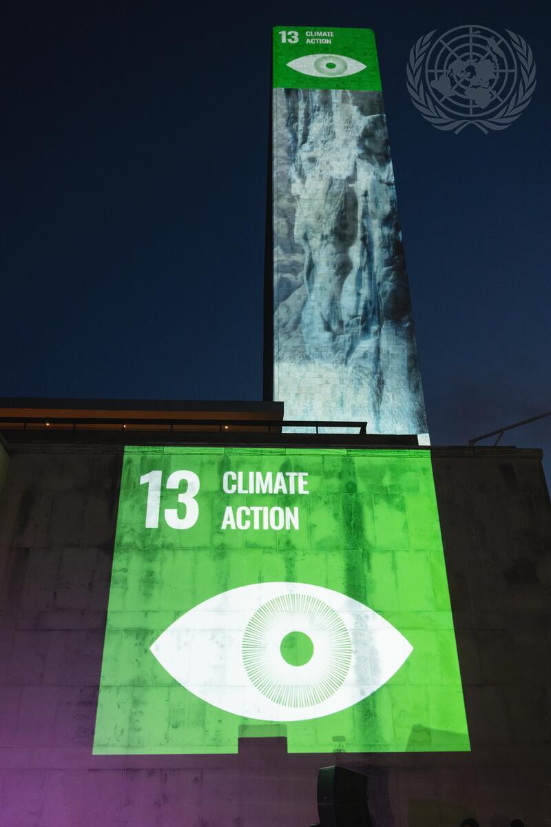 Landmark launch of Scoring for the Goals event with projection of images of green SDG 13 symbol on UN Building during UNGA 77, New York, US, 17 September 2022