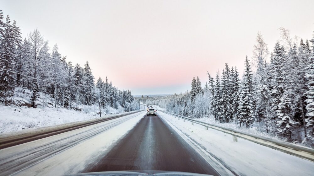 Car on a road in a winter landscape