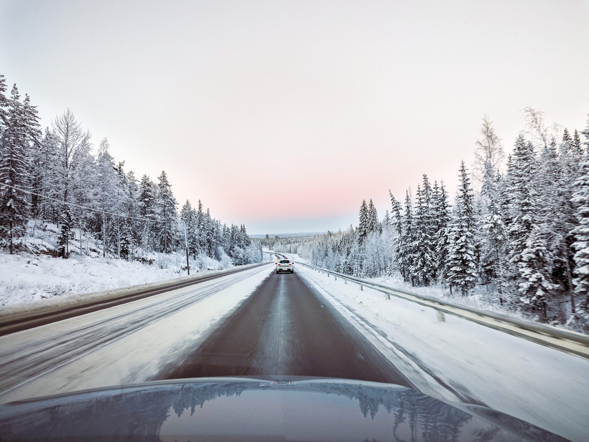 Car on a road in a winter landscape