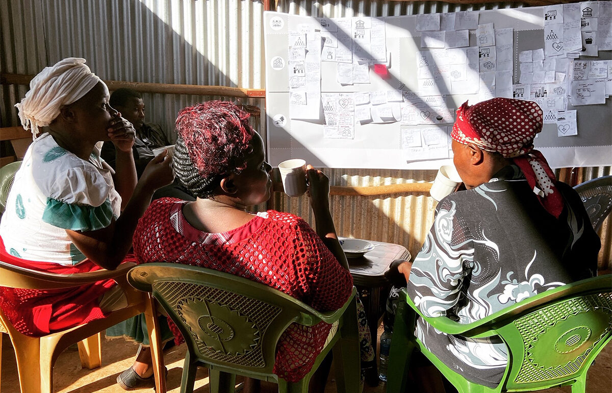 Workshop participants discuss the road map over a cup of tea, Kitulu Village, Kenya