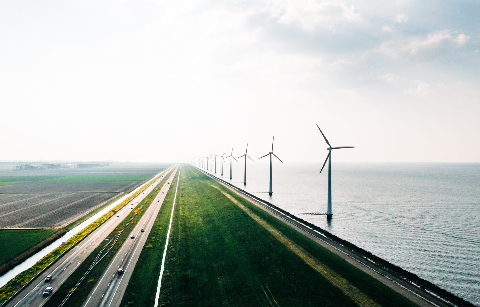 A dutch energy farm on the coast. An aerial view of wind turbines, Holland - stock photo
